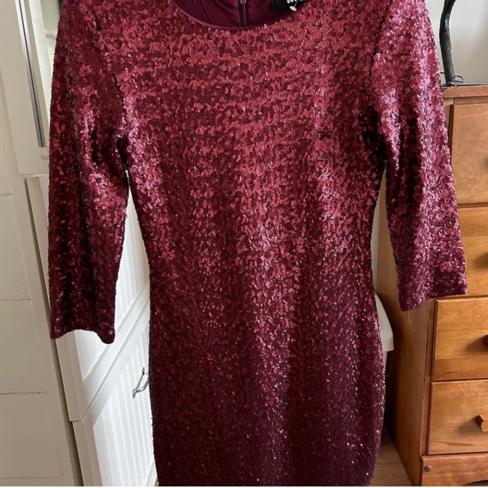 Red sequinned mini dress.
